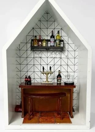 A miniature bar scene styled on a shelf