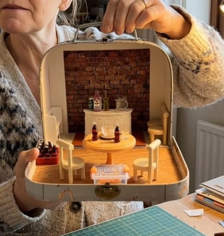 Mini pub scene in a suitcase