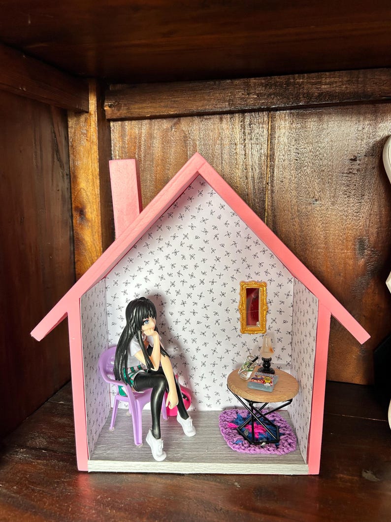 scene on a shelf Anime doll sitting casually by fireside or coffee table scene. — photo 4